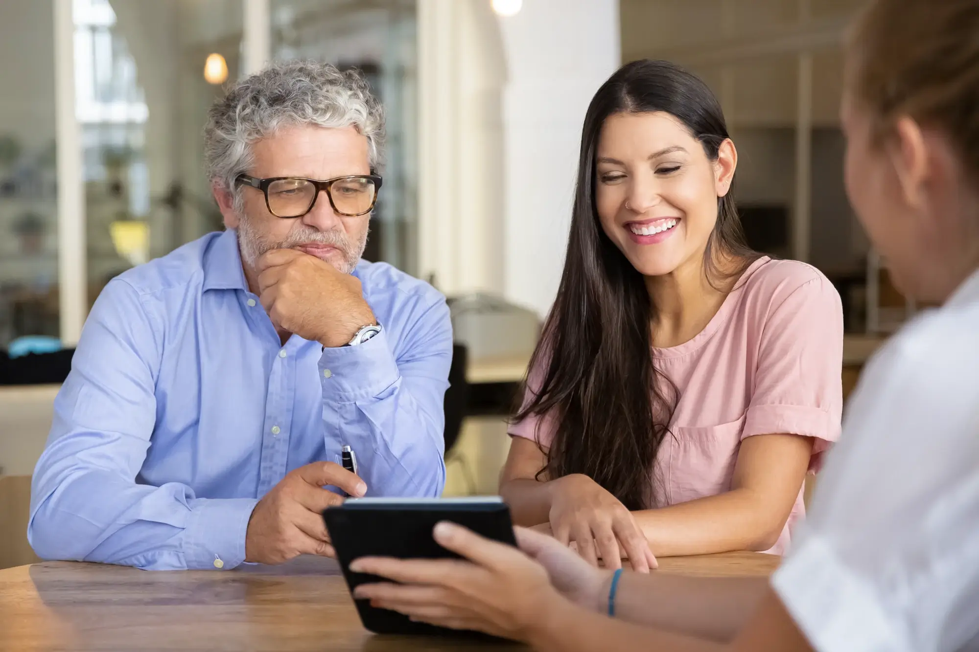 Image of product owner showing progress on tablet to stakeholders